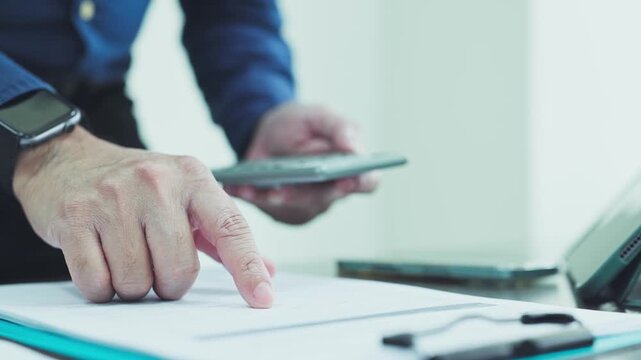 Auditor conducts audit inspection, reviewing financial report data during audit analysis.