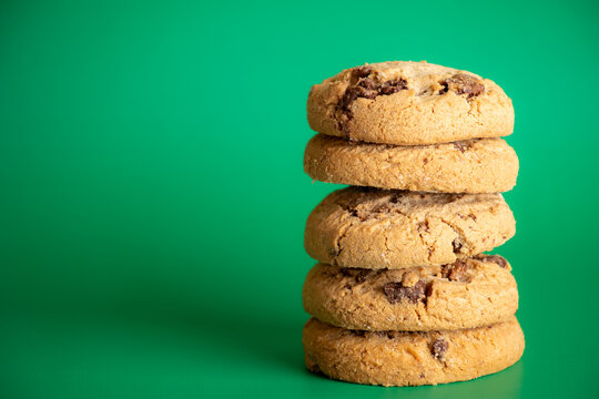 Chocolate chip cookie stack right aligned with green copy space