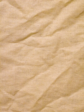 Beige Woven Fabric Texture with Natural Wrinkles and Folds
