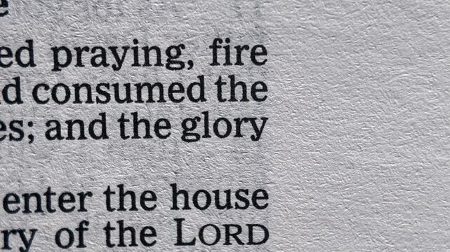 Glory in Bible scripture macro close up with changing pages Christian faith spirituality and divine glory
