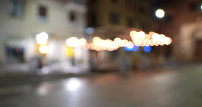 Bokeh - A Saturday night in a square in Milan