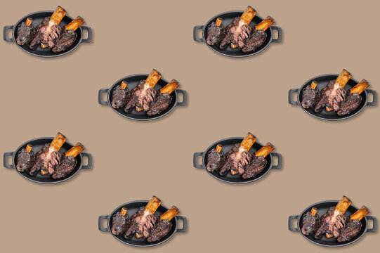Braised beef ribs in black oval dishes repeated across a taupe background in a decorative barbecue food pattern