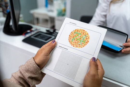 Holding Ishihara Test Booklet