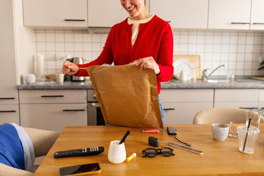Woman opening mail package