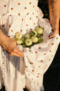 Anonymous woman with apples