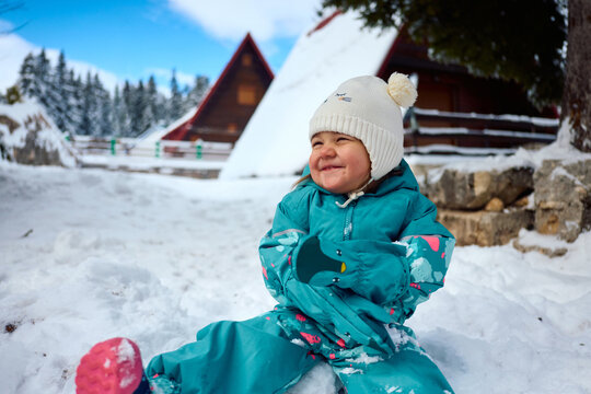 Happy child having fun at snow