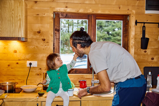 Child with father in kitchen