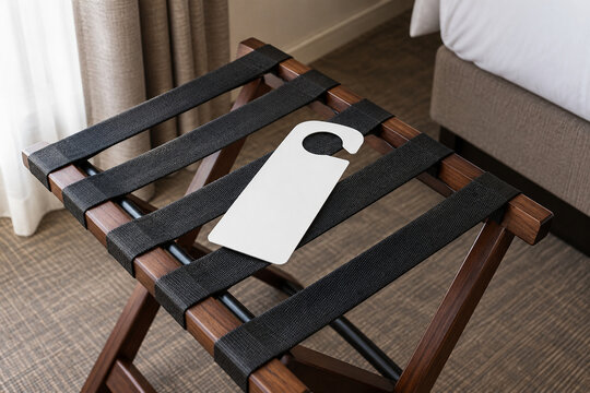 Hotel luggage rack with blank door hanger tag