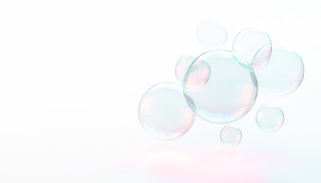 淡い虹色に輝く透明なシャボン玉が浮かぶ白い背景