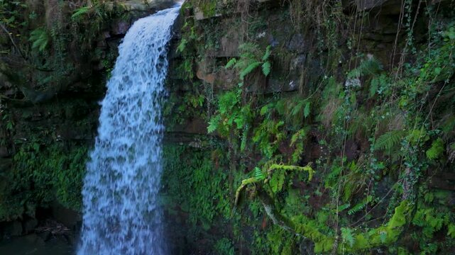 Aerial drone view of a winter landscape and waterfall near Selaya in the Pasiegos Valleys, Cantabria, Spain, Europe