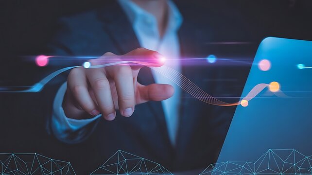 Businessman interacting with digital data visualization and glowing futuristic technology interface