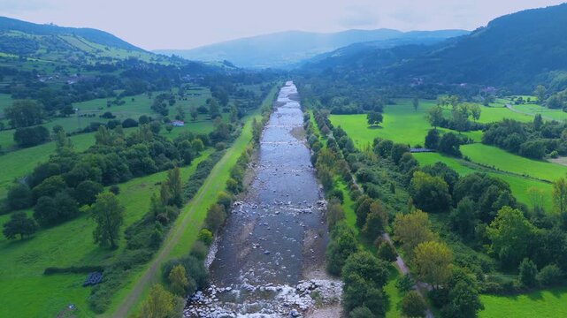 Aerial view from a drone of the Pas River in Corvera de Toranzo. Pas Valley in the Pasiegos Valleys region. Cantabria. Spain. Europe