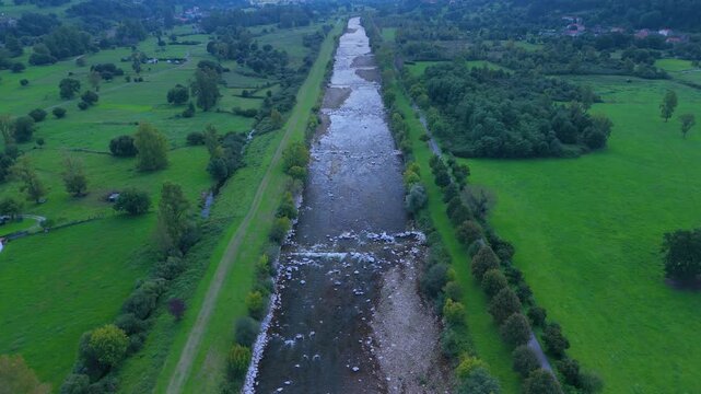 Aerial view from a drone of the Pas River in Corvera de Toranzo. Pas Valley in the Pasiegos Valleys region. Cantabria. Spain. Europe