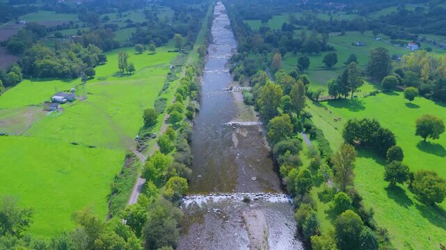 Aerial view from a drone of the Pas River in Corvera de Toranzo. Pas Valley in the Pasiegos Valleys region. Cantabria. Spain. Europe