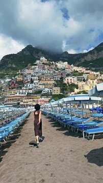 Happy Woman Running on Empty Positano Beach Amalfi Coast Italy