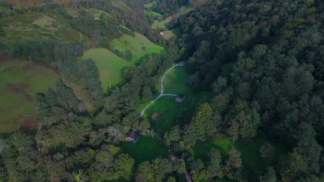 Aerial drone view of a winter landscape of hay meadows and forests in the Pisue&ntilde;a Valley. Los Valles Pasiegos region. Cantabria. Spain. Europe