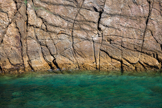 Aerial view of dramatic cliffs, sea stacks, and turquoise water along Costa Quebrada coastline, Cantabria, Northern Spain