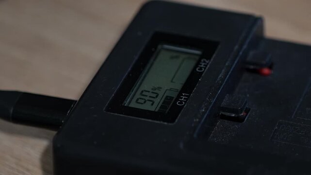 A close-up of a digital screen showing ninety percent.