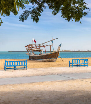 Traditional Arabic dhow fishing boat on a sandy beach 