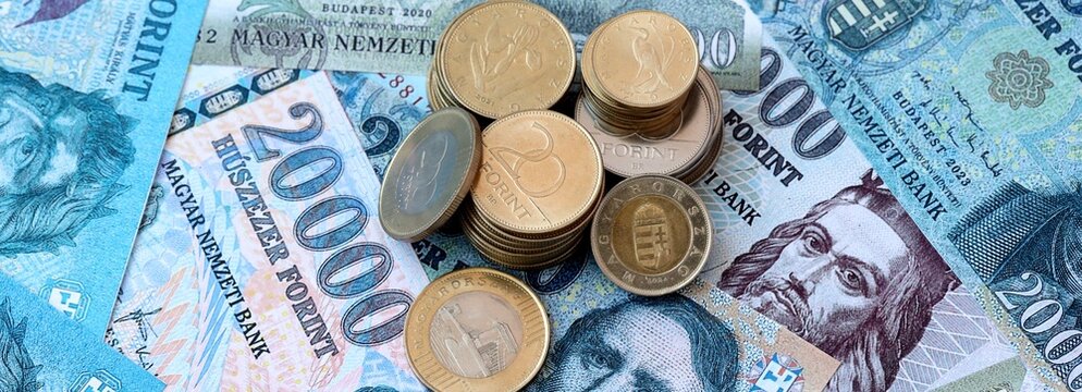 Hungarian forint money banknotes and coins on table. Hungary cash bills of HUF currency