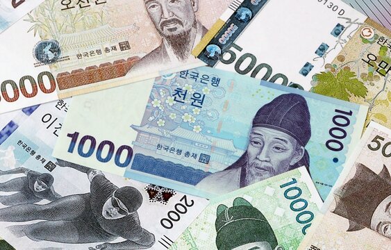 Big amount of South Korean won money banknotes. South Korea cash bills of KRW currency close up