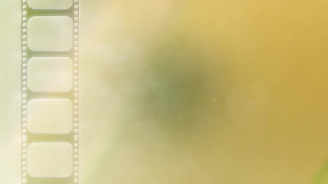 cinema film reel strip moving downwards down the screen with a dreamy spotlight cinematic animated motion background film awards or film review background graphic from the golden age of cinema 4K