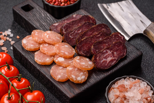 Sliced dry cured beef sausage or basturma with salt and spices. Sliced basturma