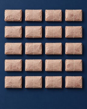 Meat recall packages of ground beef wrapped in crinkled butcher paper on a navy background, a clean flat lay mockup for food safety