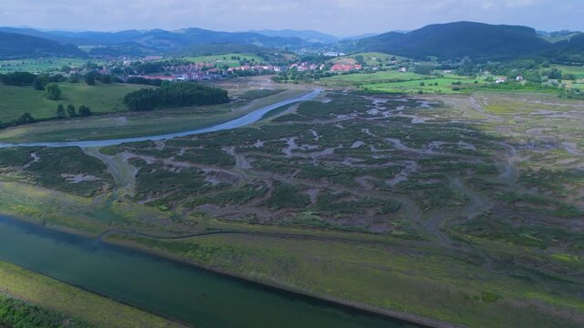 Aerial drone view of the marshes at low tide in Escalante in the Marismas de Santo&ntilde;a, Victoria y Joyel Natural Park. Cantabrian Sea. Santo&ntilde;a, Cantabria, Spain, Europe