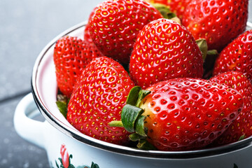 Fresh ripe strawberries in a bowl, close-up © Anastasia