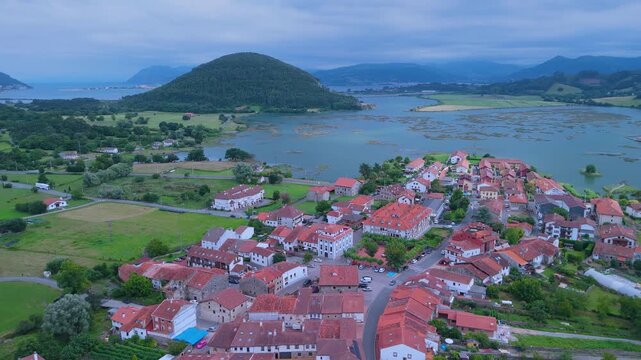 Church of Santa Cruz and town of Escalante seen from a drone in the Parque Natural de las Marismas de Santo&ntilde;a, Victoria y Joyel Natural Park. Cantabrian Sea. Escalante, Cantabria, Spain, Europe