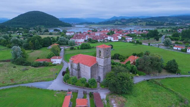 Church of Santa Cruz and town of Escalante seen from a drone in the Parque Natural de las Marismas de Santo&ntilde;a, Victoria y Joyel Natural Park. Cantabrian Sea. Escalante, Cantabria, Spain, Europe