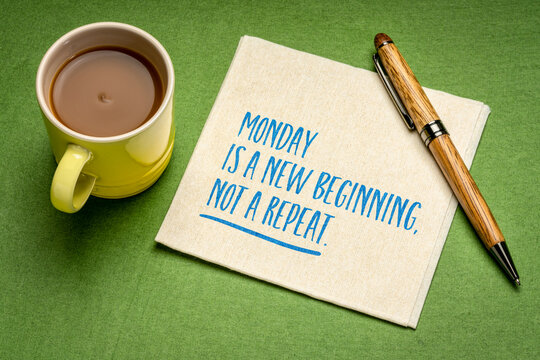Monday is a new beginning, not a repeat. Inspirational handwritten quote on a napkin with coffee. Fresh starts, personal change, breaking routines, and approaching a new week with a positive mindset.