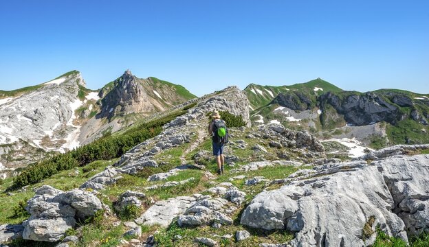 Hiker on a hiking trail, Haidachstellwand, 5-summit via ferrata, behind Ro&szlig;kopf and Seekarlspitze, hiking at the Rofan Mountains, Tyrol, Austria