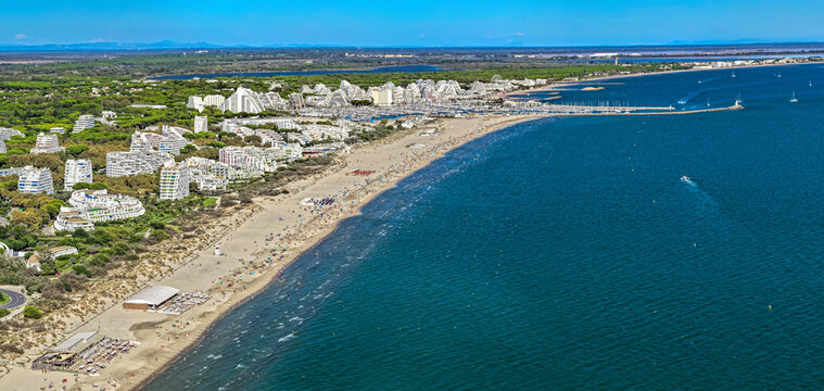 Aerial view of people swimming and relaxing on the beach in La Grande-Motte, H&eacute;rault, South of France