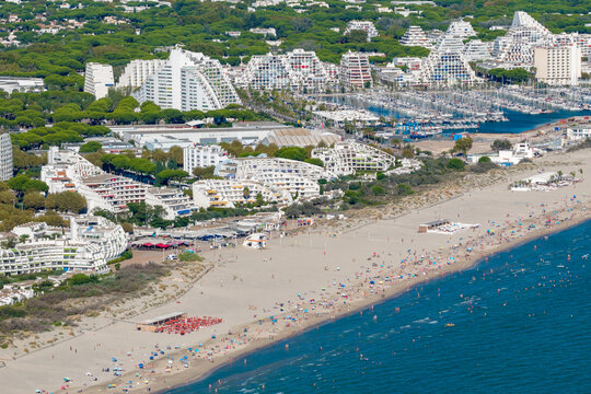 Aerial view of people swimming and relaxing on the beach in La Grande-Motte, H&eacute;rault, South of France