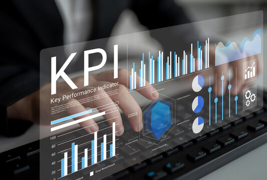 A business professional is analyzing key performance indicator data displayed on a transparent digital interface. Graphs and charts show insights for effective performance measurement. Gantry