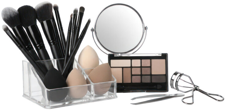 Professional makeup brush set and cosmetic palette collection.