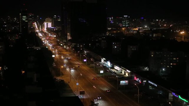 Urban road traffic after sunset in Kyiv