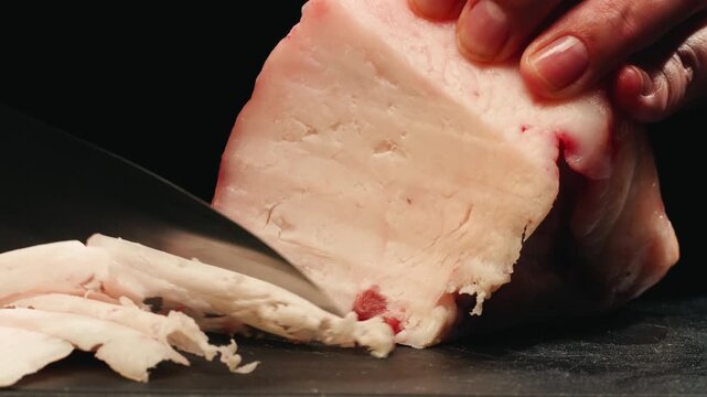 Raw lamb sheep fat tail fat on wooden board, close up of middle eastern pork or lamb dish. Rotating macro meat. 