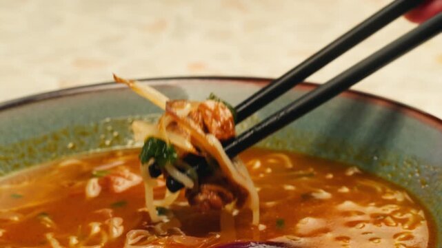 Vietnam traditional pho bo soup on delivery, Beef noodles. Pho Bo Soup with beef, rice noodles, ginger, lime, chili pepper in bowl. Vietnamese cuisine. Pho Noodle Soup restaurant Close-up.