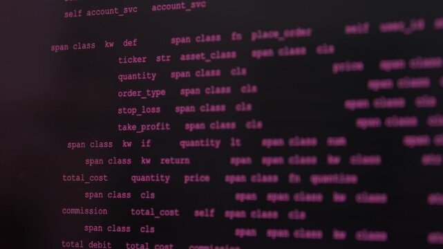Code text updates across dark screens in stylized programming display. Vibe coding and AI assisted software work are suggested by changing code, with pink syntax highlighting and shallow focus.