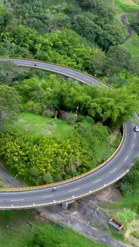 La Estampilla Curved Viaduct near Manizales, Colombia. Establishing Shot. Aerial View. Vertical Video.