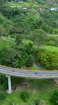 La Estampilla Curved Viaduct near Manizales, Colombia. Establishing Shot. Aerial View. Vertical Video.