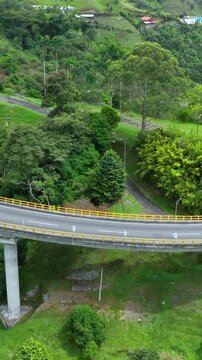 La Estampilla Curved Viaduct near Manizales, Colombia. Establishing Shot. Aerial View. Vertical Video.