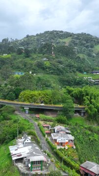 La Estampilla Viaduct with Traffic near Manizales, Colombia. Establishing Shot. Aerial View. Vertical Video.