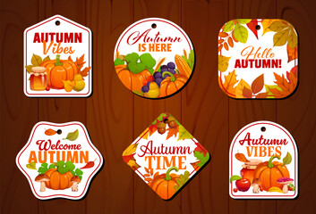 Fototapeta premium Autumn fall season tags with seasonal quotes and leaves. Vector Thanksgiving harvest labels with pumpkin, fruit, mushroom, corn and foliage. Cartoon seasonal cards and badges set on wooden background