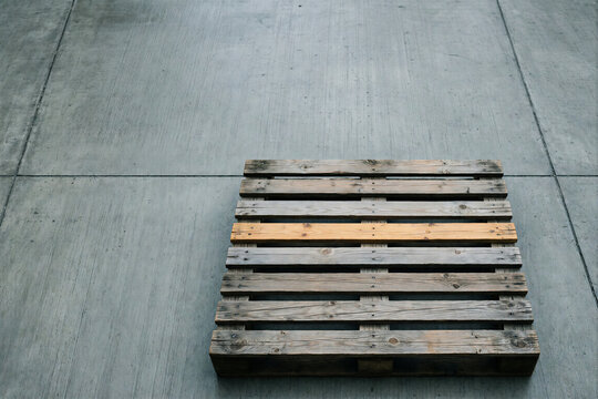 Wooden pallet on concrete floor