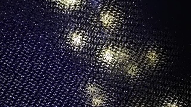 textured background with blurred yellow lights and a flashing blue light