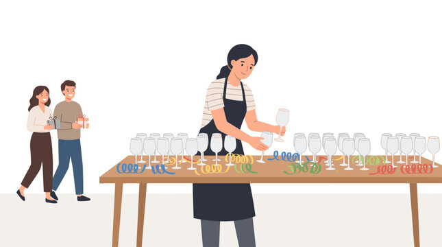 Catering staff member arranges glassware on a table for an event while guests walk by